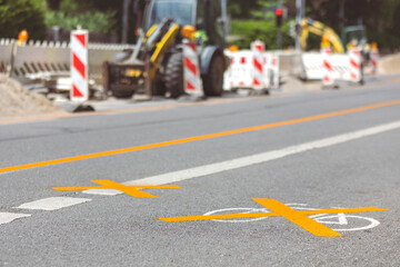 Road sign Bike Crossed out with Yellow Paint on Asphalt on Bike Path on Road Closed Background....