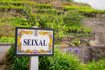 Village of Seixal, name road sign made of azulejos ceramic tilles in the island of Madeira, Portugal