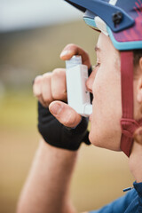 Asthma, inhaler and cyclist with medical and breathing medicine for fitness and training. Outdoor,...