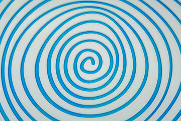 Simple white spiral on blue paper background