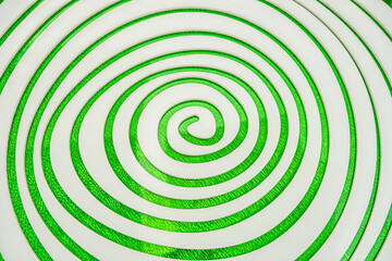 Fototapeta na wymiar Simple white spiral on green Sparkling background