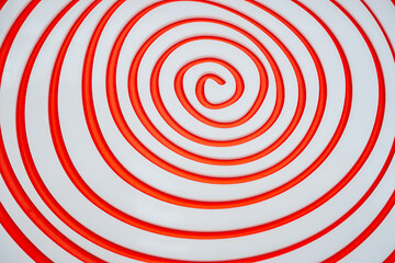 Simple white spiral on orange paper background