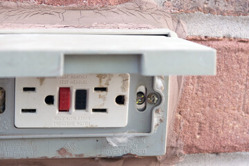 An electrical outlet and plug