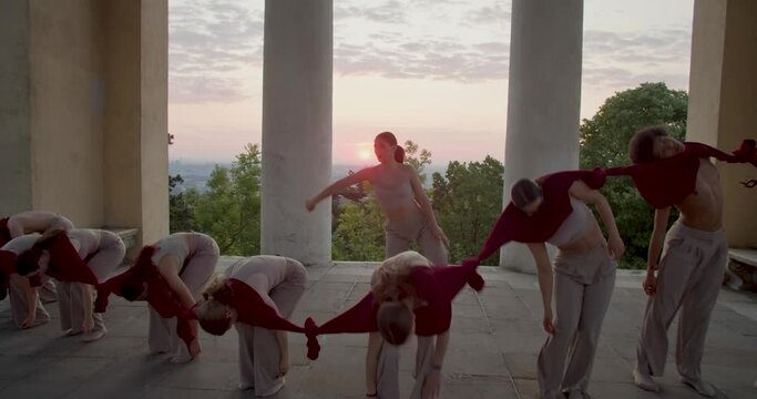 Social issues in an interpretive dance outdoors, group of young people, 4k