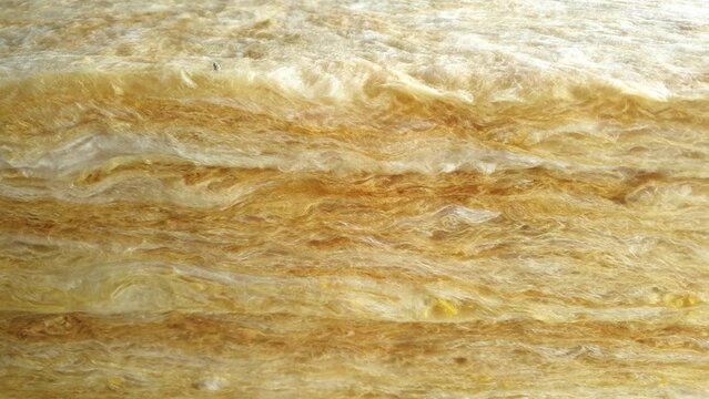 Mineral wool thermal insulation batt.Glass wool industrial building material at a construction site. Glass insulation, fiberglass.