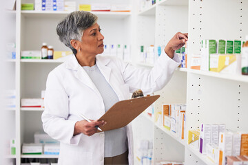 Pharmacy, writing and clipboard of woman with medicine on a shelf for pharmacist inventory. Mature...