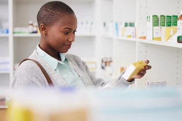 Foto op Canvas Medicine, search and shopping with black woman in pharmacy for medical, pills and information. Healthcare, product and retail with female customer and box for inventory, wellness and supplements © Nadia L/peopleimages.com