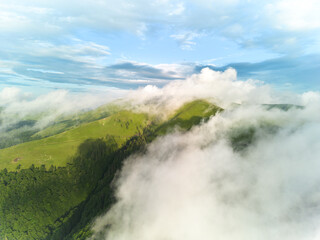 Top view from drone of mountain valley in low clouds.Mountains in clouds .