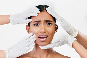 Plastic surgery, scared and face of woman with hands of prp doctors on white background in studio....