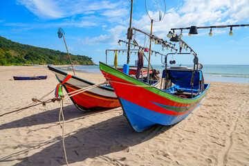 Naklejka na ściany i meble Colorful fishing boat stranded on the sand of Ba Kantiang Beach on Koh Lanta island in the Andaman Sea, Krabi Province, Thailand