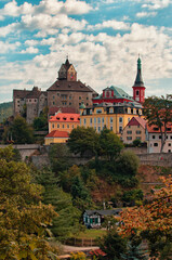 Stunning landscape view of ancient Loket castle in Czech Republic. Famous touristic place and romantic travel destination. Romantic castle with colorful houses. UNESCO World Heritage Site