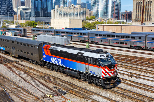 Skyline with METRA commuter rail train public transport near Union Station in Chicago, United States