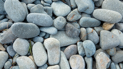 close up view of pebbles on the beach. Abstract nature pebble background. Small sea stones on the beach, vacation at sea. top view. Zen balance, minimalism, harmony and peace