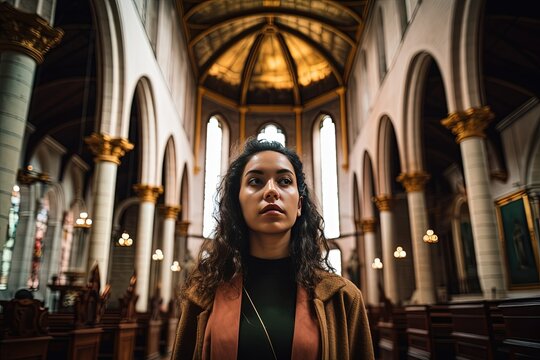 Portrait of a beautiful young woman with curly hair in a brown coat standing in a church. Catolicism, christianity. Generative AI.