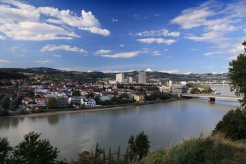 Fototapeta na wymiar Linz city view in Austria. Danube river bridges and city skyline.