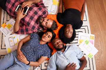 Overhead shot of multiracial group of developers and designers sleeping start up