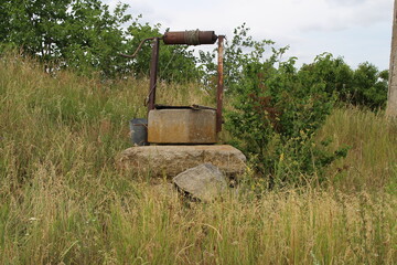 Fototapeta na wymiar A well in a field