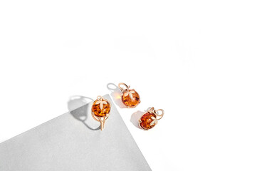 Elegant jewelry set. Jewellery set with gemstones. Jewelry accessories collage. Product still life concept. Ring, necklace and earrings.