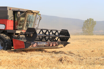 Fototapeta premium Image of combine harvester harvesting wheat.