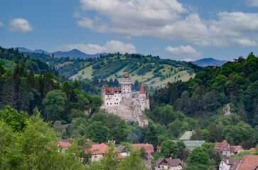 Fototapeta na wymiar Medieval Bran Castle also known as Dracula Castle and surrounding area in Bran, Brasov, Romania. The Castle was built to guard the mountain pass between Transylvania and Wallachia.