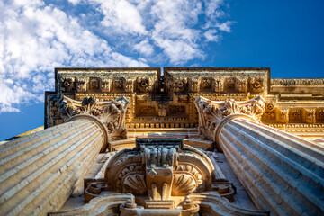 View from below of a detail of the columns and cornices of the facade of the Church of San Pedro de Arcos de la Frontera, Cadiz, Andalusia, Spain © AntonioLopez