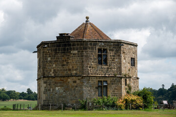 the conduit house the round tower or water tower of Cowdray house Midhurst West Sussex England