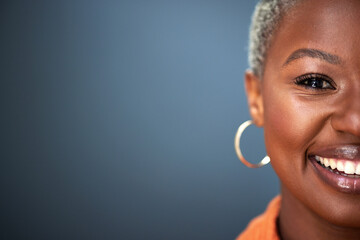 Mockup, smile and half portrait of black woman in studio with space against grey background. Happy,...