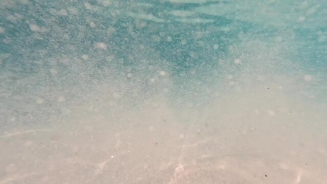 Glittering sands deep sea underwater in Maldives Indian Ocean