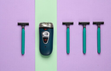 Electric shavers and razors on pastel background. Flat lay