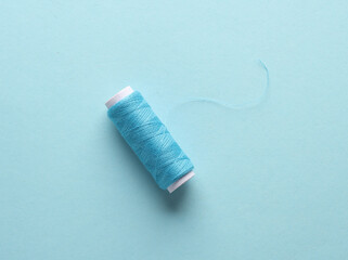 Skein of blue threads on a blue background