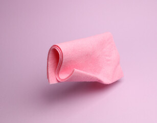 Pink rag floating on a pink background