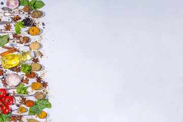 Spices for cooking on white background . Different seasonings, spices and herbs paprika, pepper, turmeric, salt, basil, mint, cinnamon, garlic and other aromatic ingredients for preparation food