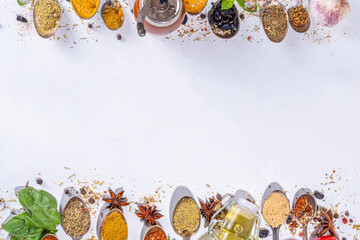 Fototapeta na wymiar Spices for cooking on white background . Different seasonings, spices and herbs paprika, pepper, turmeric, salt, basil, mint, cinnamon, garlic and other aromatic ingredients for preparation food