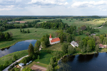 Fototapeta na wymiar Aerial view of Araisi evangelical lutheran church and archaeological park near Cesis, Latvia