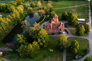 Jaunmoku brick medieval castle and its territory near Tukums, Latvia, drone view - obrazy, fototapety, plakaty
