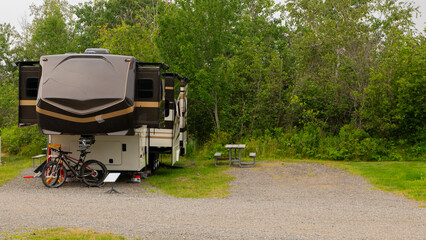 Camping in fifth wheel at campsite 