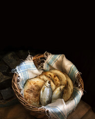 Five loaves and two fish in a basket