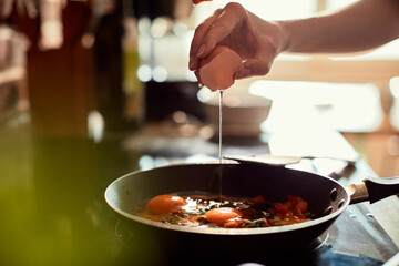Young woman cooking in the kitchen