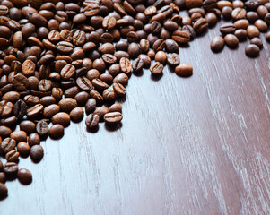 Coffee grains on a wooden table