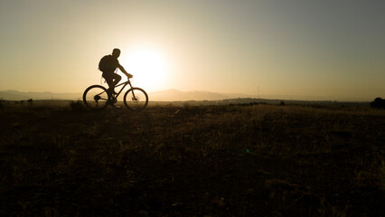 Obraz premium Sun-Kissed Adventure: Conquer the Mountains on Two Wheels