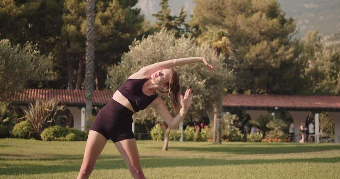 The girl performs a lean to the left