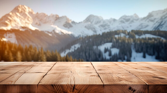 Wooden table top with blur background of alpine snow capped.