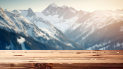Wooden table top with blur background of alpine snow capped.
