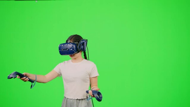 The little girl design artist VR headset creation 3d virtual reality world. Child in cyberspace get immersive experience on chroma key green screen. Concept VR immersive experience in virtual reality