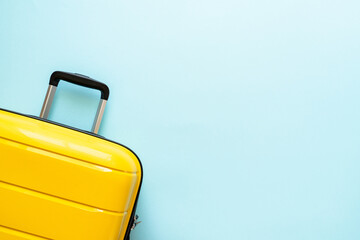 Suitcase on blue background. Travel concept. Happy Holidays, vacation.