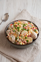 Homemade Summer Potato Salad in a Bowl, side view.