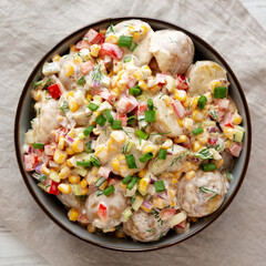 Homemade Summer Potato Salad in a Bowl, top view. Flat lay, overhead, from above.