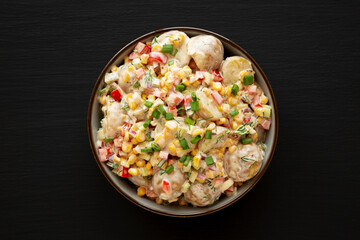 Homemade Summer Potato Salad in a Bowl, top view. Flat lay, overhead, from above.