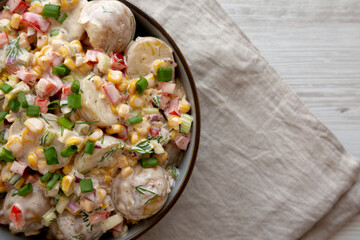 Homemade Summer Potato Salad in a Bowl, top view. Flat lay, overhead, from above. Copy space.