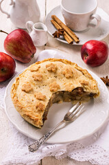 Traditional French apple cake served as close-up on a classic design plate
